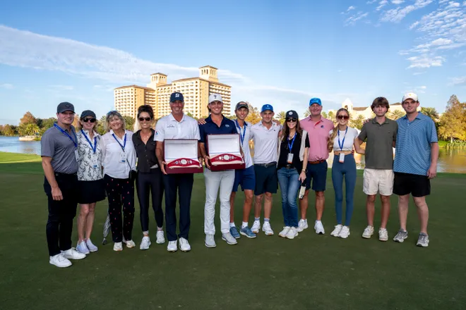 Matt Kuchar and son Cameron celebrate PNC victory with family.
