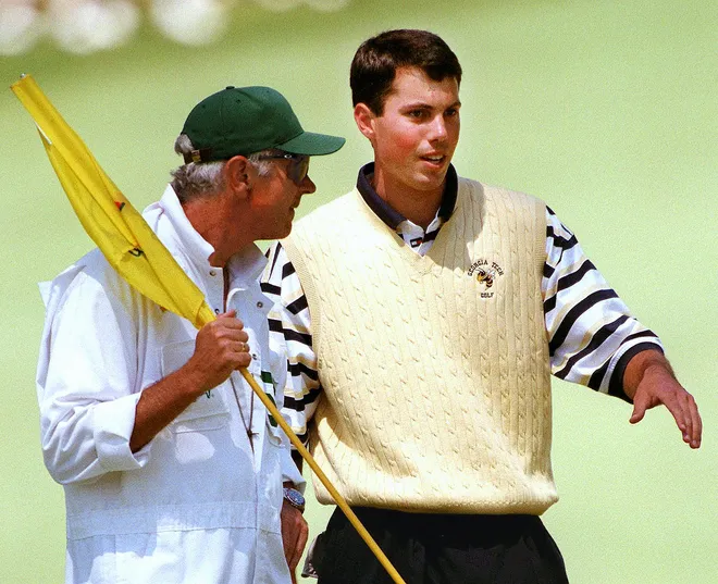 Matt Kuchar and his father Peter discuss a putt on the 10th green during third round of the 1998 Masters at Augusta National Golf Club.