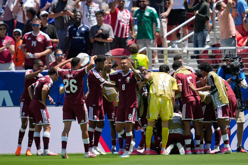 Qatar players celebrate after scoring during the World Cup Group B soccer match between Qatar and Switzerland in Santa Clara, Calif., near San Francisco, Saturday, June 13, 2026. (AP Photo/Eugene Hoshiko)