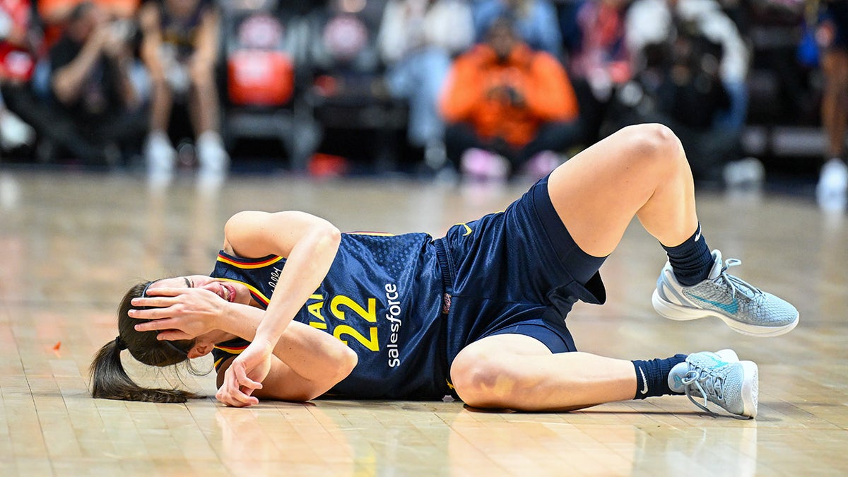 Indiana Fever guard Caitlin Clark reacts to a foul during a WNBA playoff game at Mohegan Sun Arena