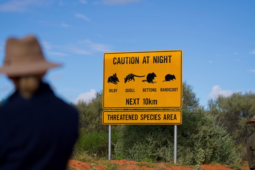A road sign warning motorists about threatened species.