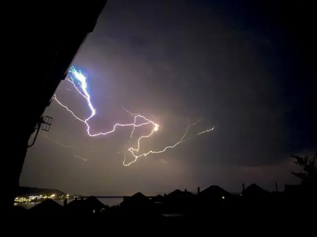 lightning cuts across a dark sky in the south west of wales