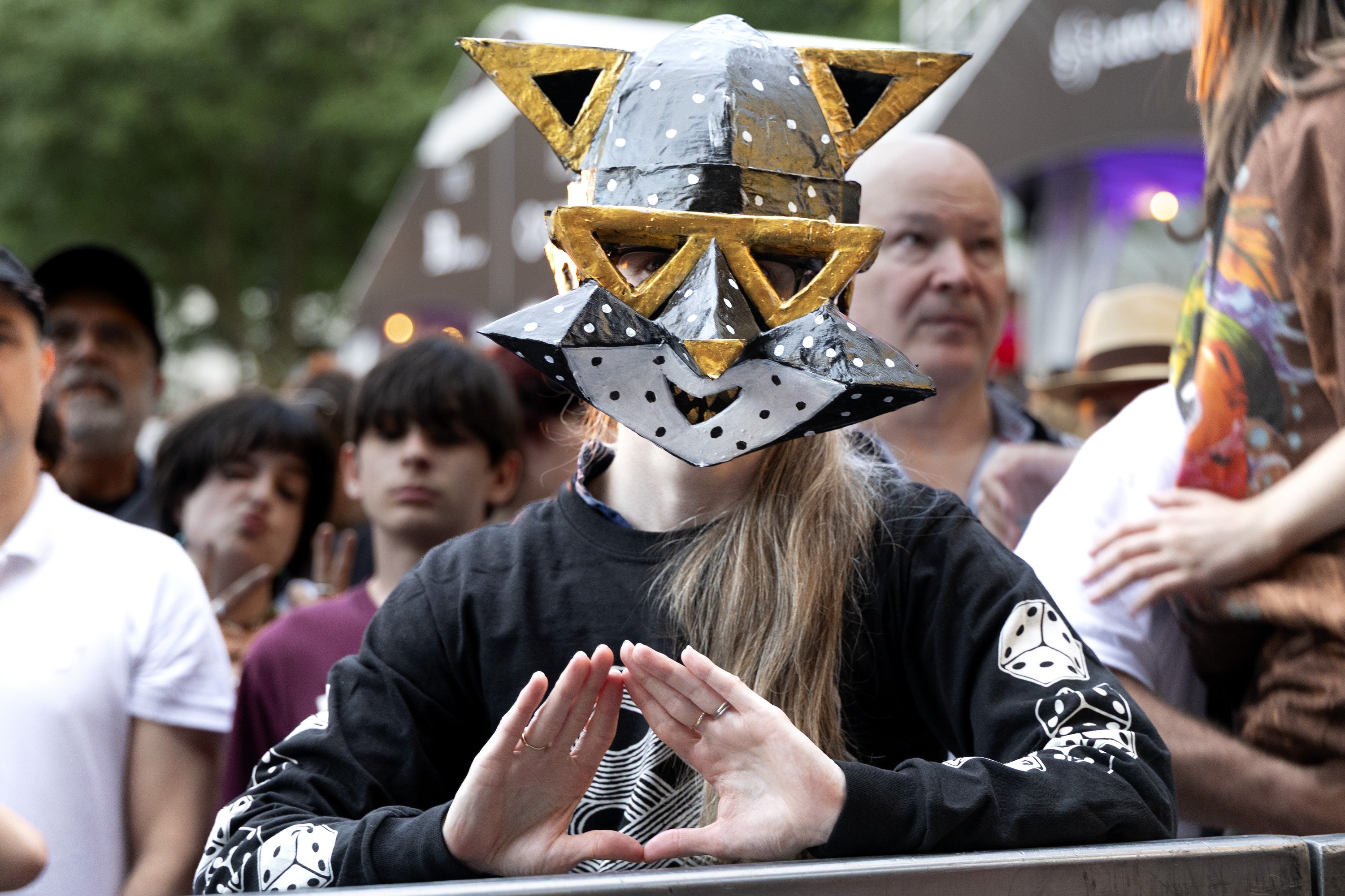 A fan dresses up to see the band Angine de Poitrine.