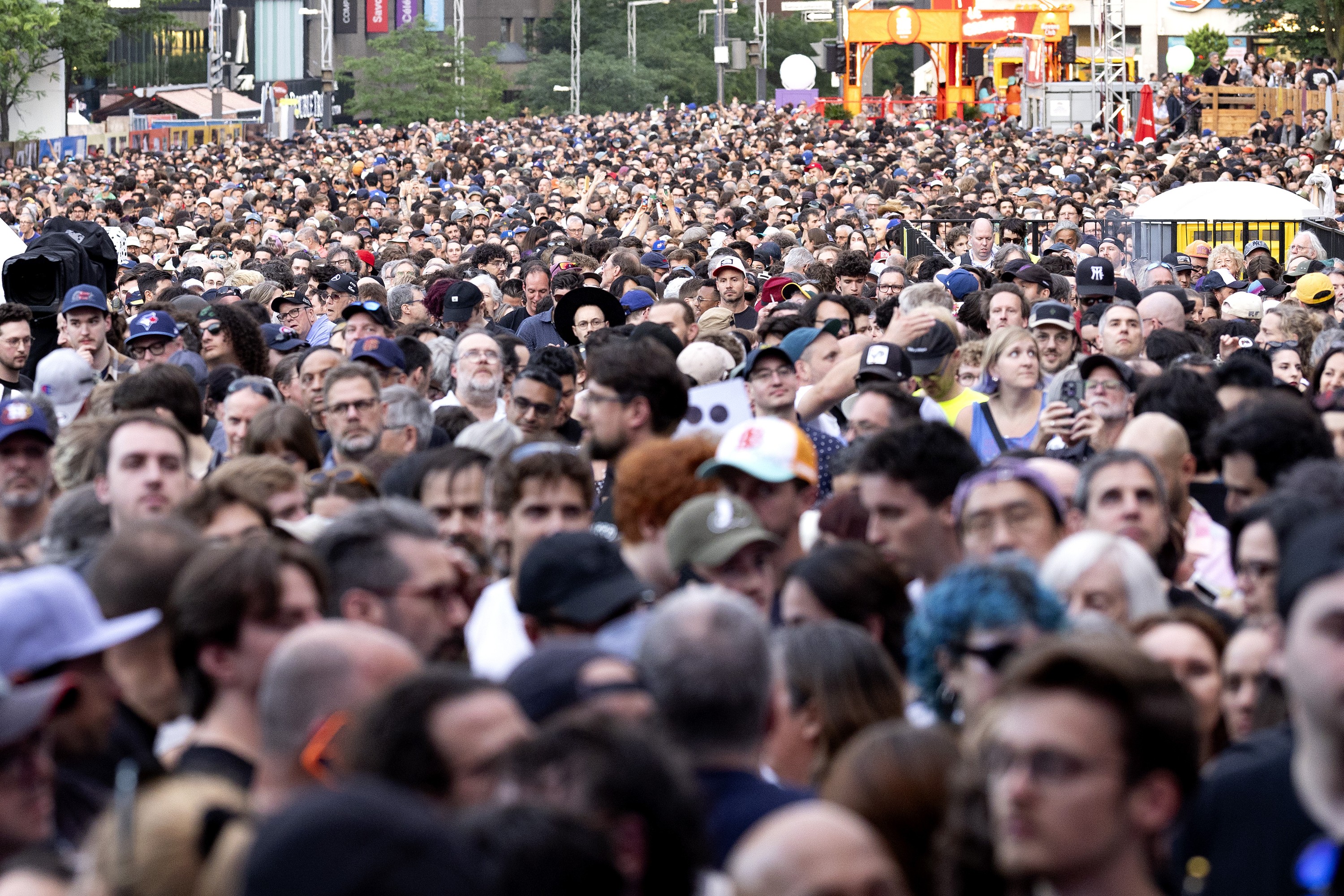 A sea of people arrive early to see Angine de Poitrine perform on the Montreal International Jazz Festival's main outdoor stage.