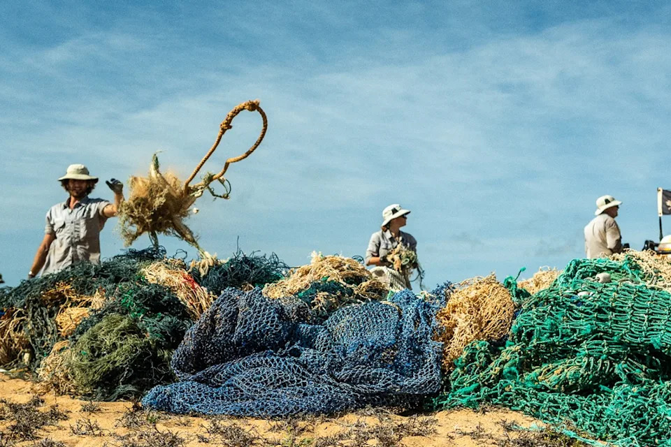 Volunteers and the local Indigenous Rangers clean up discraded fishing nets in the Top End.