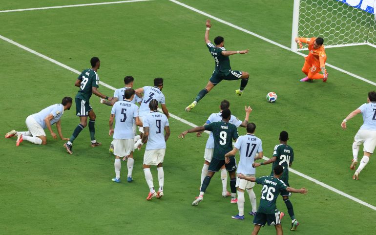 MIAMI, FLORIDA - JUNE 15: Abdulelah Al-Amri #4 of Saudi Arabia scores his team's first goal past Fernando Muslera #23 of Uruguay during the FIFA World Cup 2026 Group H match between Saudi Arabia and Uruguay at Miami Stadium on June 15, 2026 in Miami, Florida. Molly Darlington/Getty Images/AFP (Photo by Molly Darlington / GETTY IMAGES NORTH AMERICA / Getty Images via AFP)