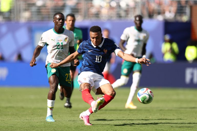France's forward #10 Kylian Mbappe shoots to score his team's third goal during the 2026 World Cup Group I football match between France and Senegal at the New York/New Jersey Stadium in East Rutherford on June 16, 2026. (Photo by CHARLY TRIBALLEAU / AFP)