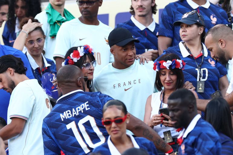 France's forward #10 Kylian Mbappe poses for a picture with relatives and friends in the stands after the 2026 World Cup Group I football match between France and Senegal at the New York/New Jersey Stadium in East Rutherford on June 16, 2026. (Photo by FRANCK FIFE / AFP)