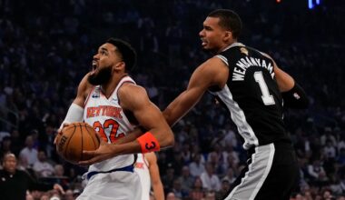 New York Knicks center Karl-Anthony Towns (32) drives past San Antonio Spurs forward Victor Wembanyama during first half of Game 4 of the NBA Finals basketball series, Wednesday, June 10, 2026, in New York. (AP Photo/Ross D. Franklin)