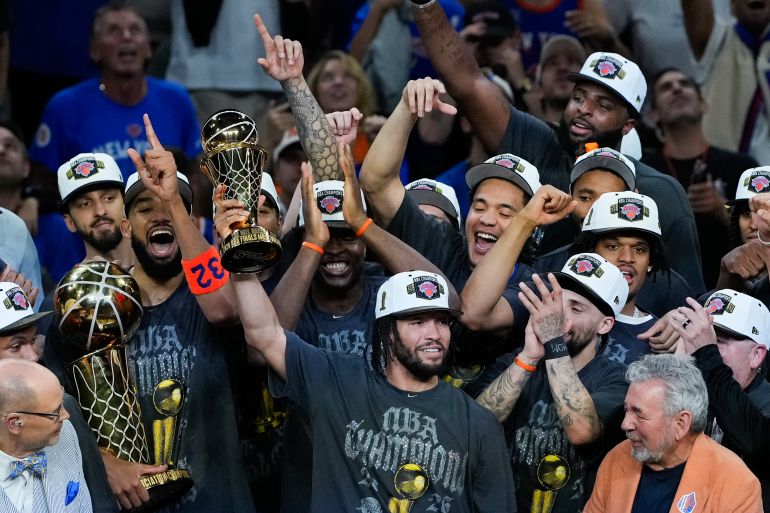 New York Knicks guard Jalen Brunson holds the MVP trophy after the Knicks defeated the San Antonio Spurs in Game 5 of the NBA Finals basketball series, Saturday, June 13, 2026, in San Antonio. (AP Photo/Ross D. Franklin)