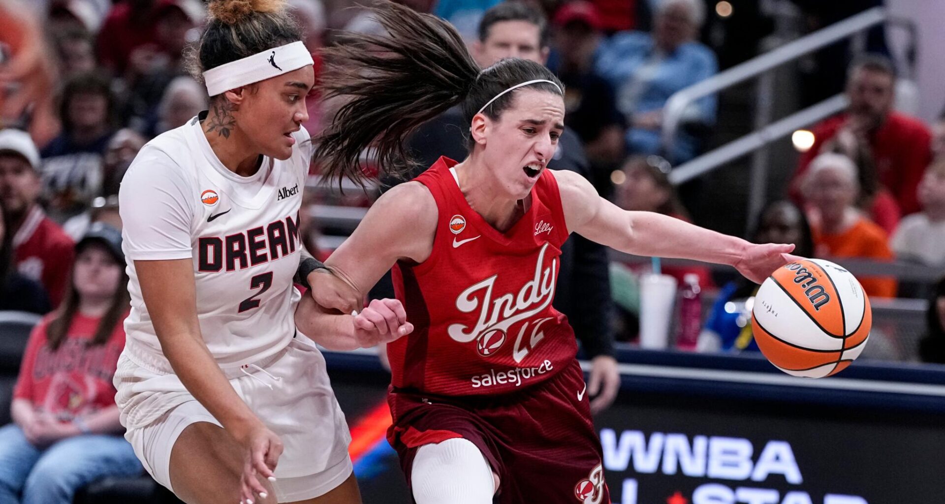 Indiana Fever guard Caitlin Clark (22) drives on Atlanta Dream guard Te-Hina Paopao (2) in the first half of a WNBA basketball game in Indianapolis, Thursday, June 18, 2026. (Michael Conroy/AP)