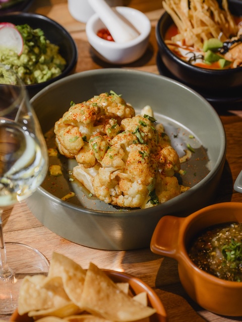 Baked Cauliflower with Mexican seasoning and chips and salsa at ACUYO