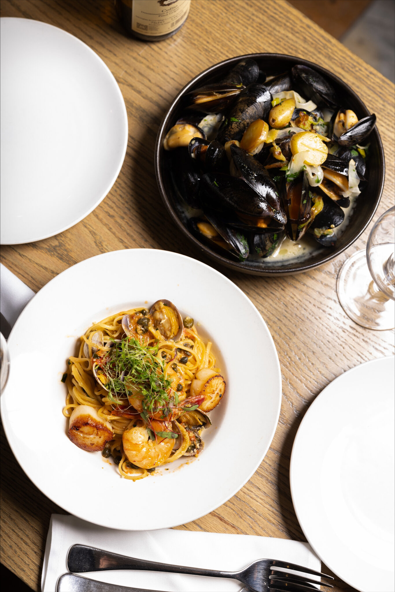 Two dishes on plates in a restaurant