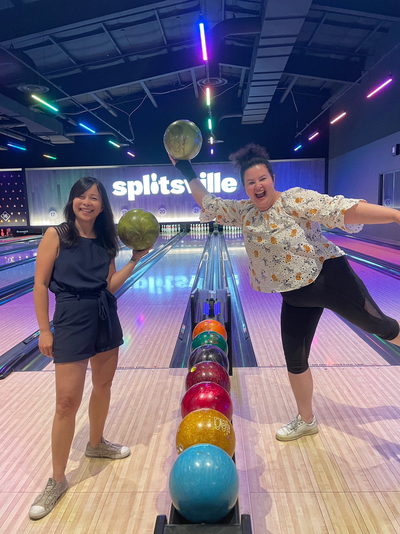Two people inside a bowling alley