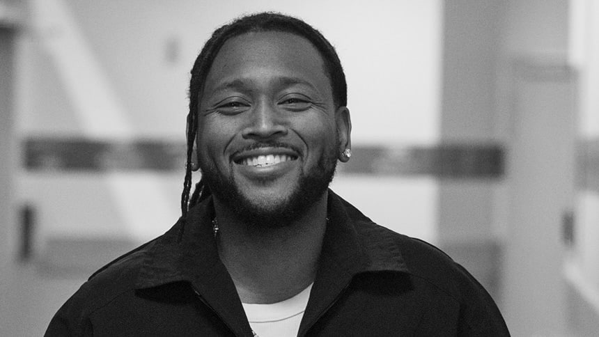 Left, music producer Boi-1da smiling straight at the camera.