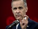 Mark Carney gestures during a press conference following the second night of debate in the federal Liberal leadership race to replace Canadian Prime Minister Justin Trudeau at the MELS studios in Montreal, Canada, on Feb. 25, 2025.