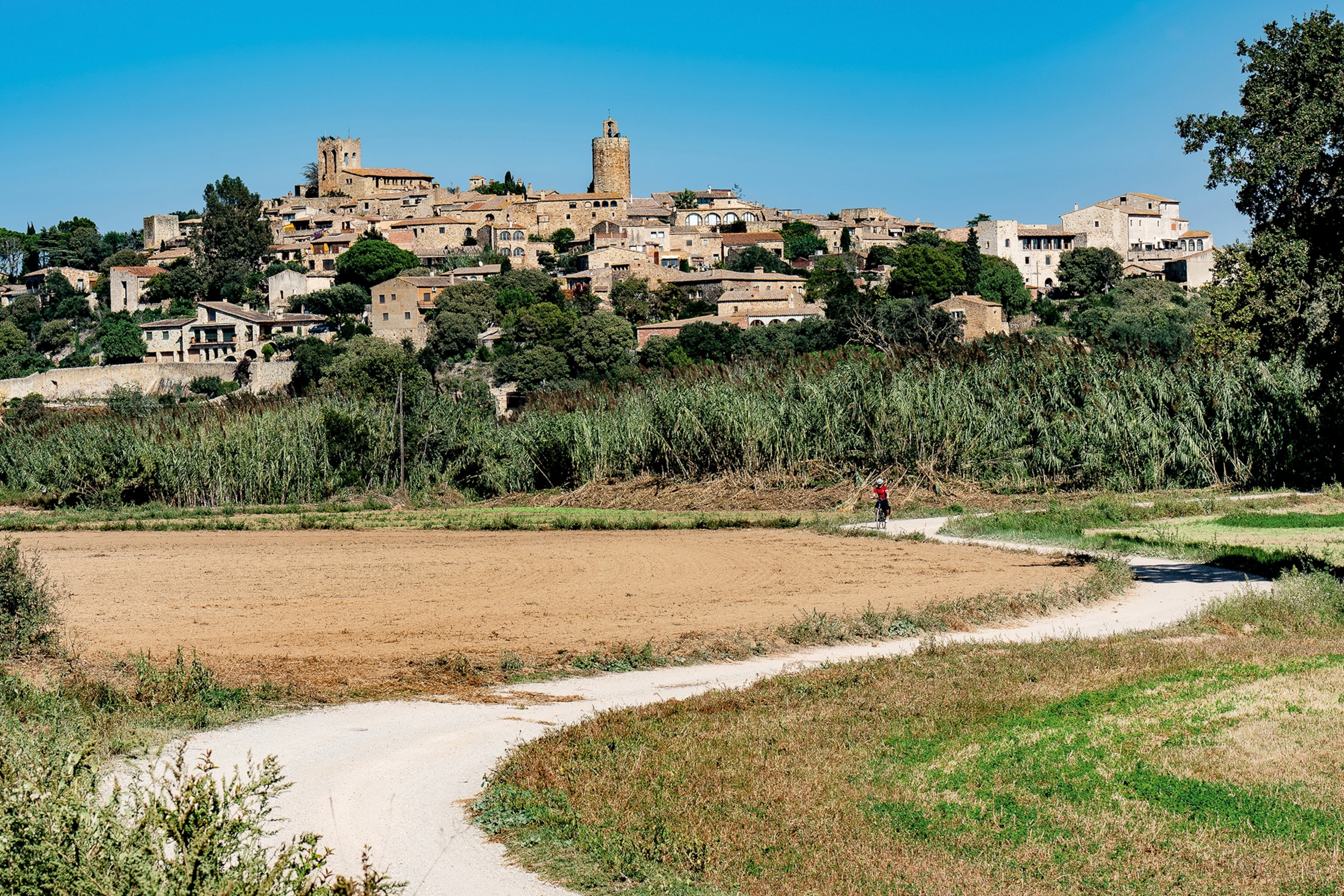 Path leading to hillside town.