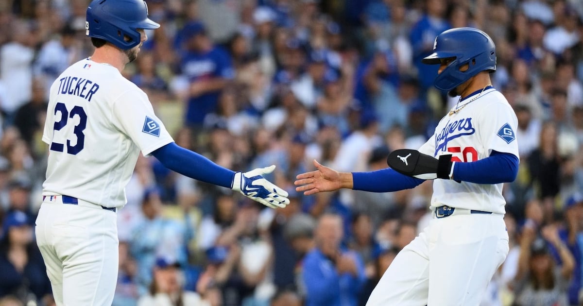 A ninth-inning throwing error lifts Los Angeles Dodgers past Baltimore Orioles