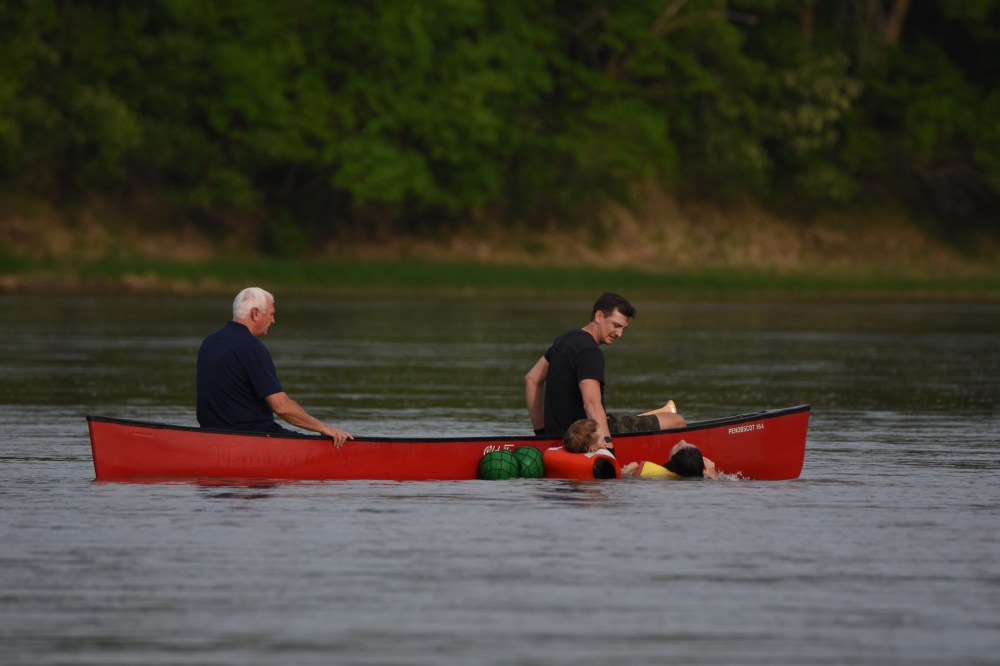 Bystanders in a canoe assisted in a rescue on the Assiniboine River on Monday night.