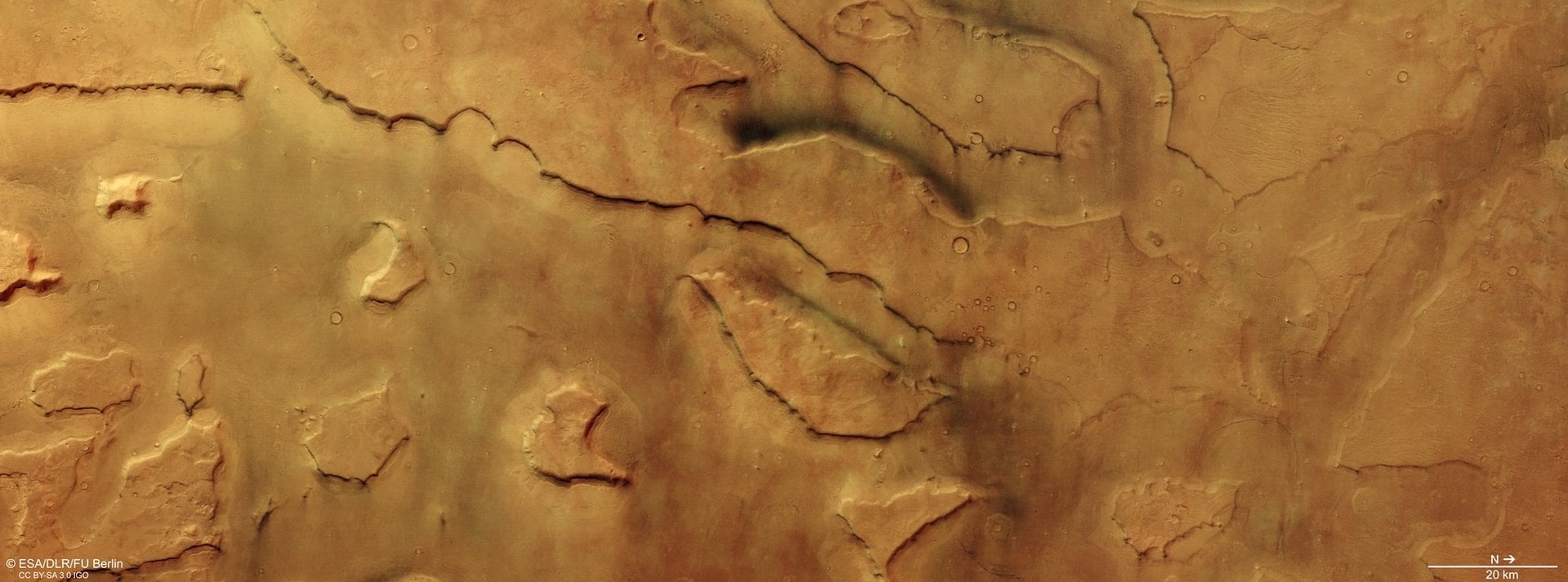 This image from ESA’s Mars Express shows part of Mamers Valles captures tens of small dust devils. Credit: ESA/DLR/FU Berlin