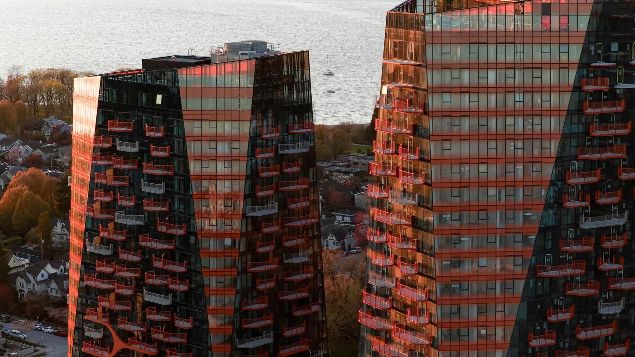 close-up view of the three completed towers in Sen̓áḵw