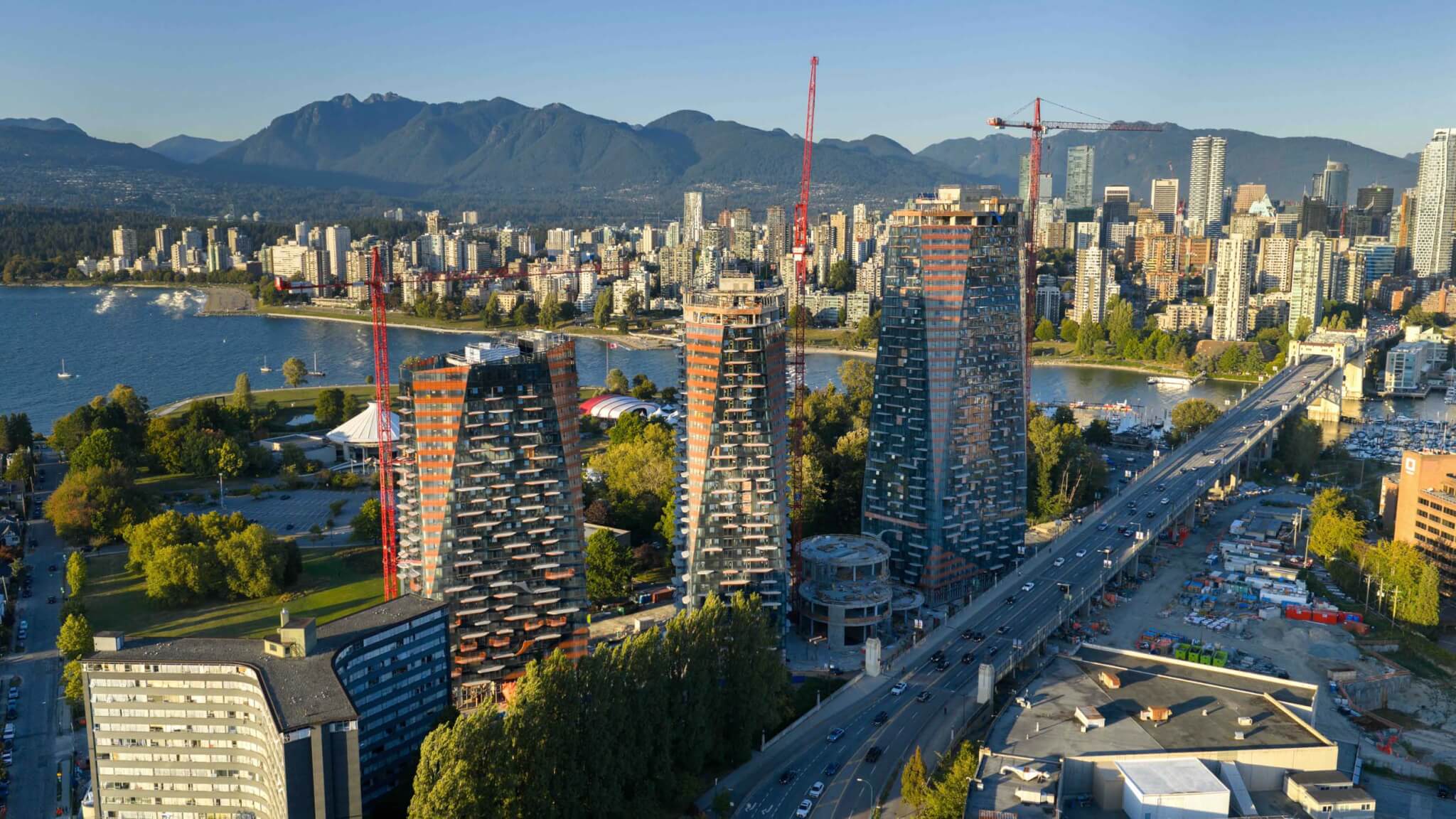 towers under construction with view of city in the distance