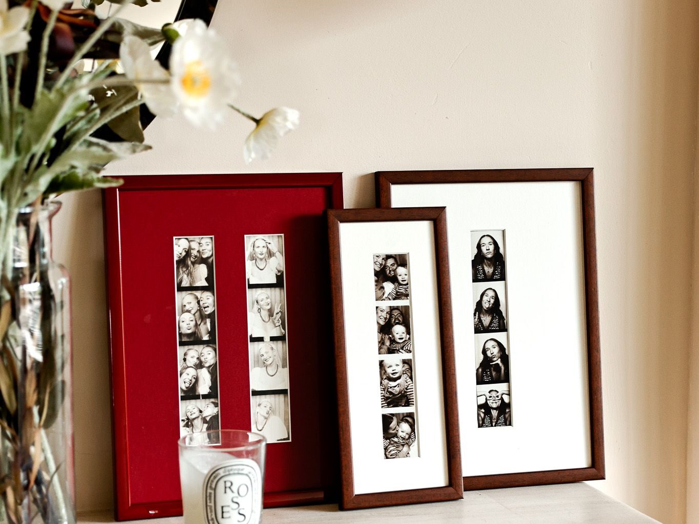 A mantel with a leaning cluster of three photo frames