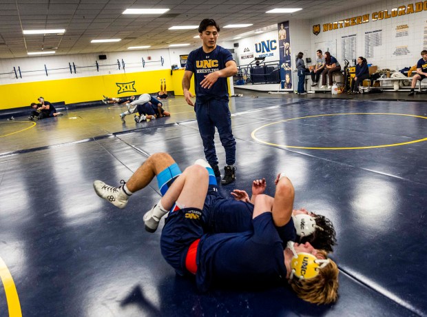 Volunteer coach Andrew Alirez watches while wrestlers do drills during a Northern Colorado Bears wrestling practice on the campus of the University of Northern Colorado in Greeley on Wednesday, Jan. 28, 2026. (Brice Tucker/Staff Photographer)