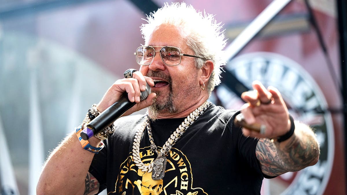 Guy Fieri smiling on stage