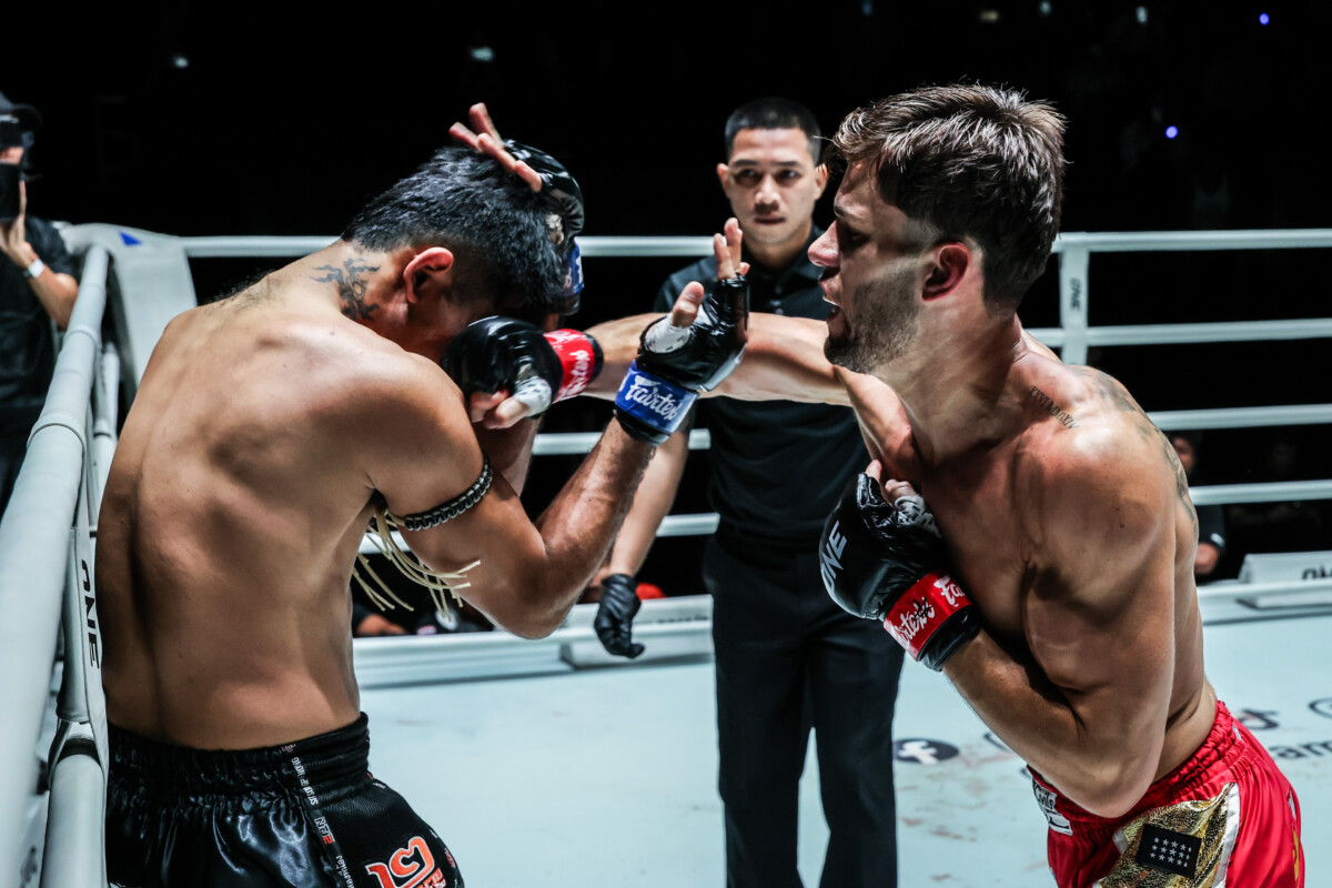 British Muay Thai fighter George Jarvis punches Rungrawee Sitsongpeenong to the head