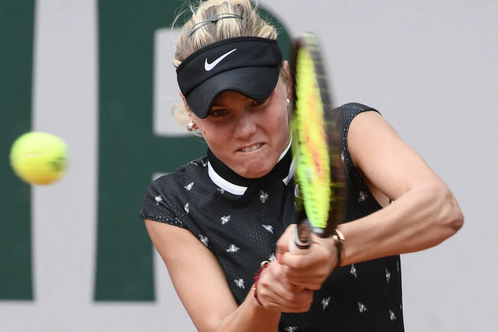 Sofya Zhuk hits a backhand against Laura Siegemund at Roland Garros in 2019.