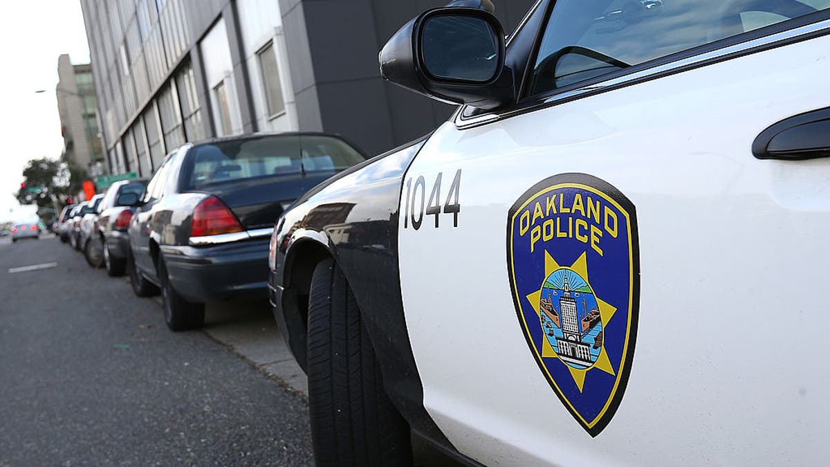 An Oakland Police patrol car parked outside Oakland Police headquarters.