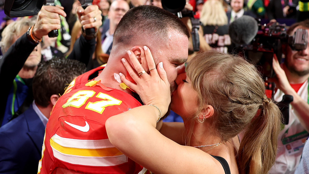 Travis Kelce #87 of the Kansas City Chiefs kisses Taylor Swift after defeating the San Francisco 49ers 25-22 in overtime during Super Bowl LVIII at Allegiant Stadium on February 11, 2024 in Las Vegas, Nevada.