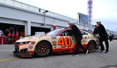 Crew members push Justin Allgaier's No. 40 Chevrolet through the Daytona garage area during the 2026 NASCAR season.