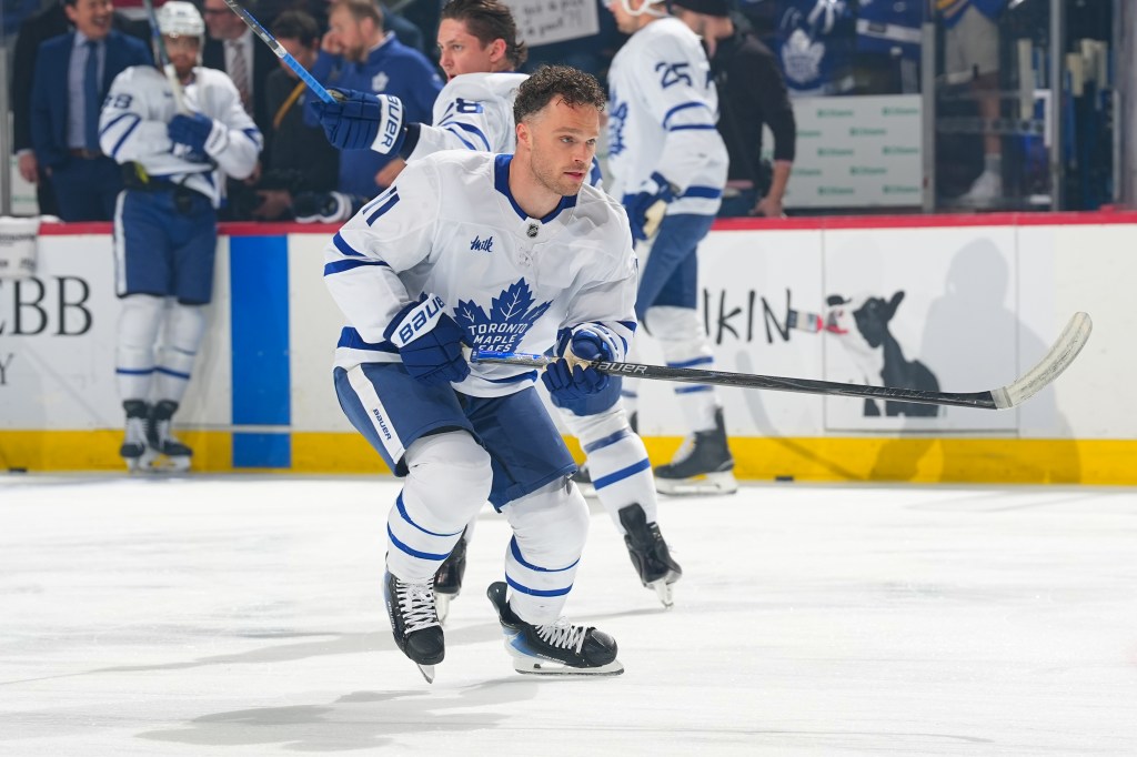 Toronto Maple Leafs player John Tavares skating on the ice during a game against the New Jersey Devils.