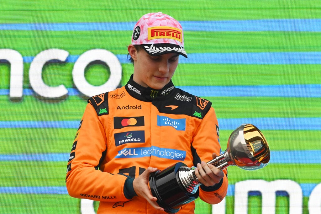 Second placed Oscar Piastri of Australia and McLaren inspects his trophy on the podium during the F1 Grand Prix of Japan at Suzuka Circuit on March 29, 2026 in Suzuka, Japan.