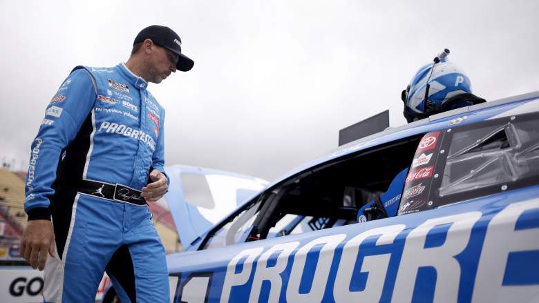 Denny Hamlin walks beside his No. 11 Toyota during NASCAR Cup Series practice at Watkins Glen International in 2026.