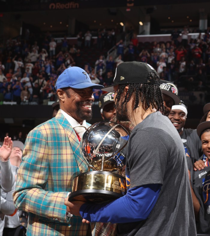 Walt Frazier presents the Eastern Conference Championship trophy to Jalen Brunson