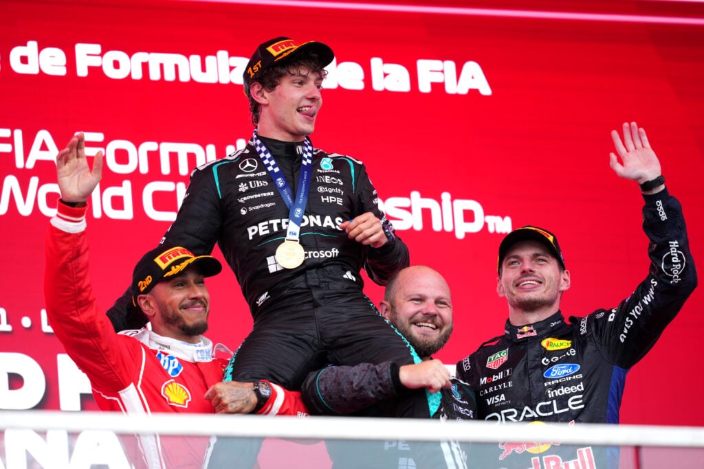 Lewis Hamilton and Max Verstappen lift Kimi Antonelli on the podium at the 2026 Canadian Grand Prix