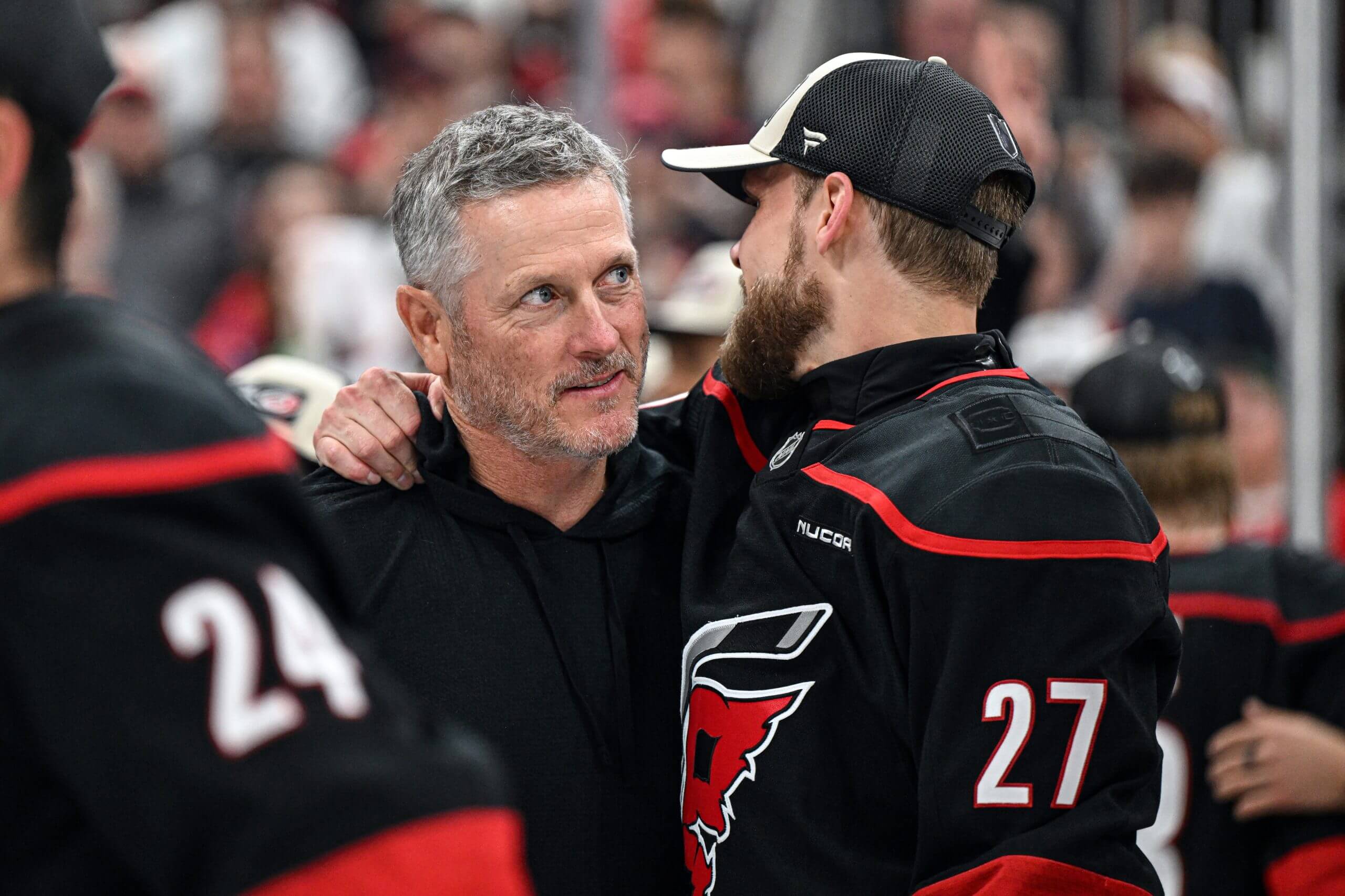 Tom Dundon and Nikolaj Ehlers share a moment on the ice after Carolina clinched its Cup Final berth.