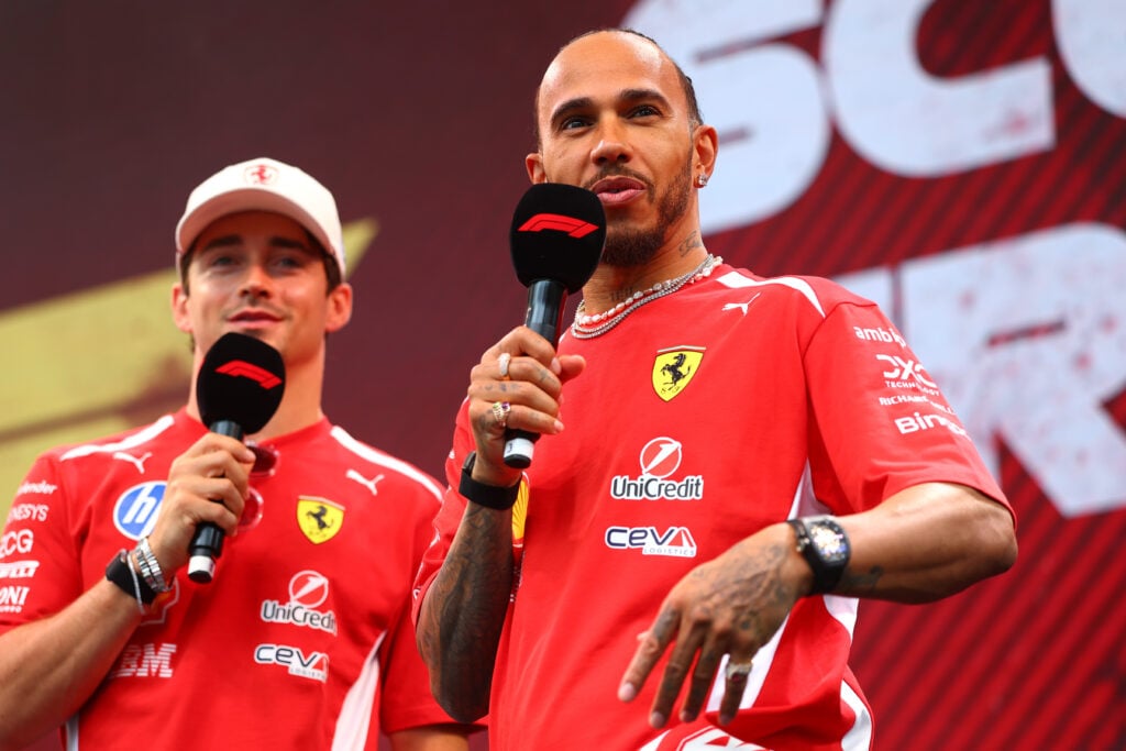 Ferrari drivers Charles Leclerc and Lewis Hamilton speak on stage at the 2026 F1 Barcelona-Catalunya Grand Prix