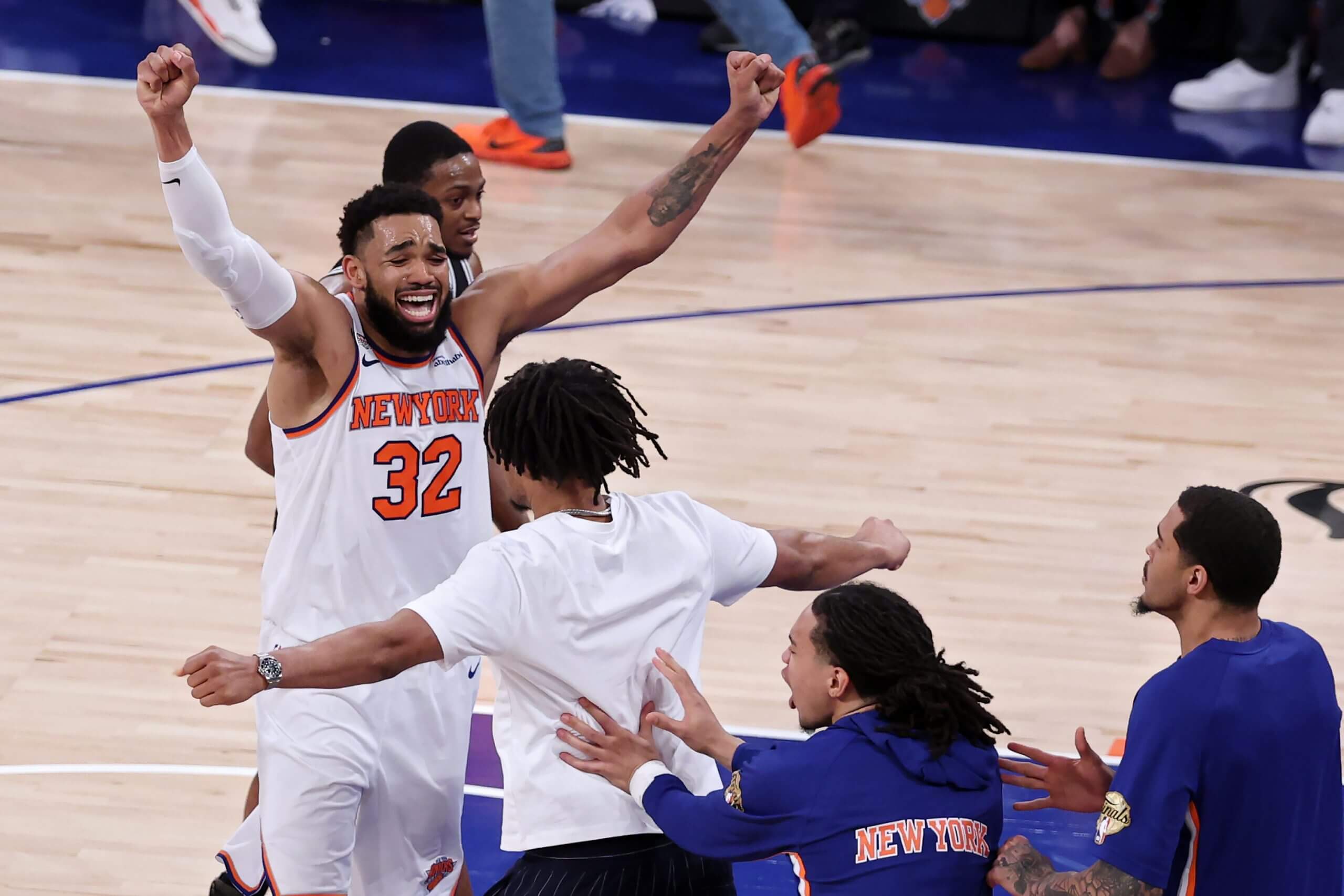 Karl-Anthony Towns celebrates after the Knicks' 107-106 victory against the San Antonio Spurs in Game 4. (Al Bello / Getty Images)