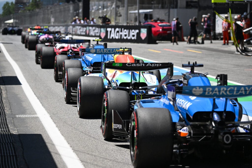 Williams driver Carlos Sainz in a queue of cars leaving the pit lane during practice at the 2026 F1 Barcelona-Catalunya Grand Prix