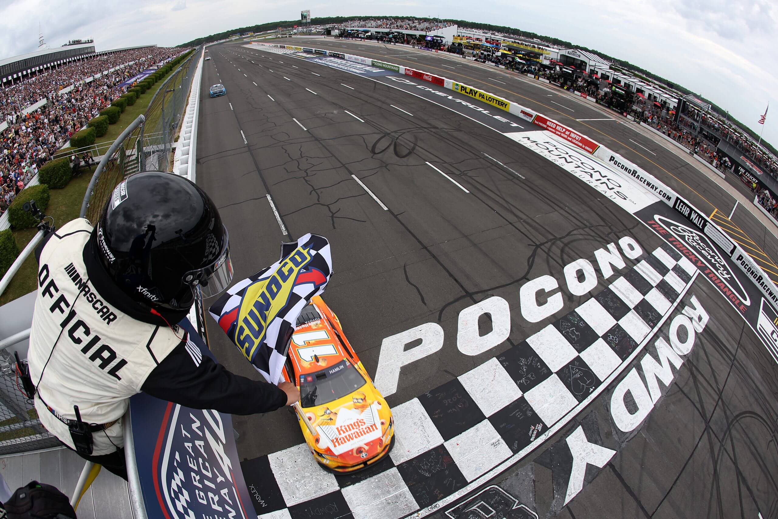 Denny Hamlin crosses the finish line at Pocono.