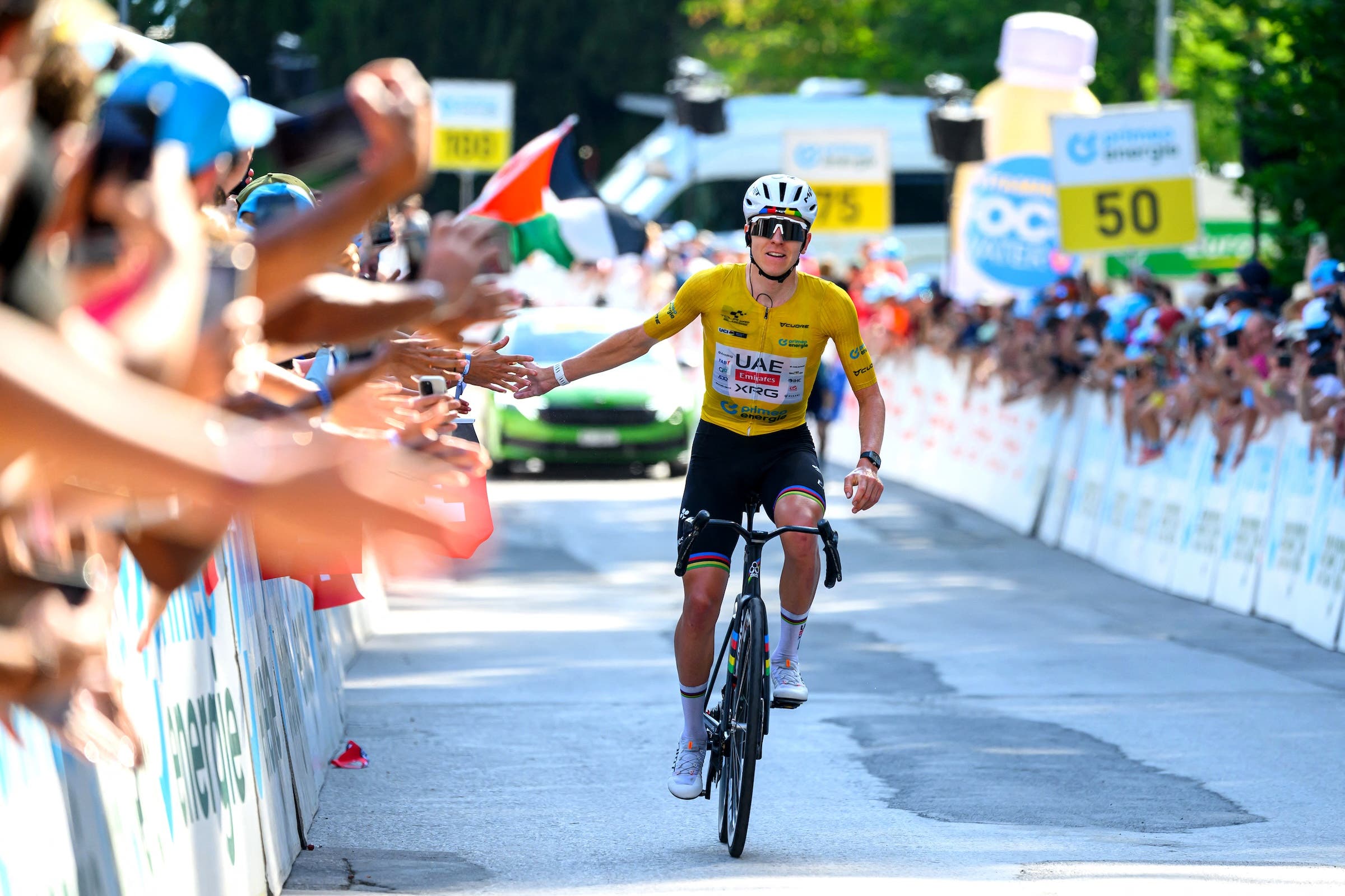 Tadej Pogačar celebrated with specators as he crossed the finish line (Photo: Harold Cunningham / AFP)