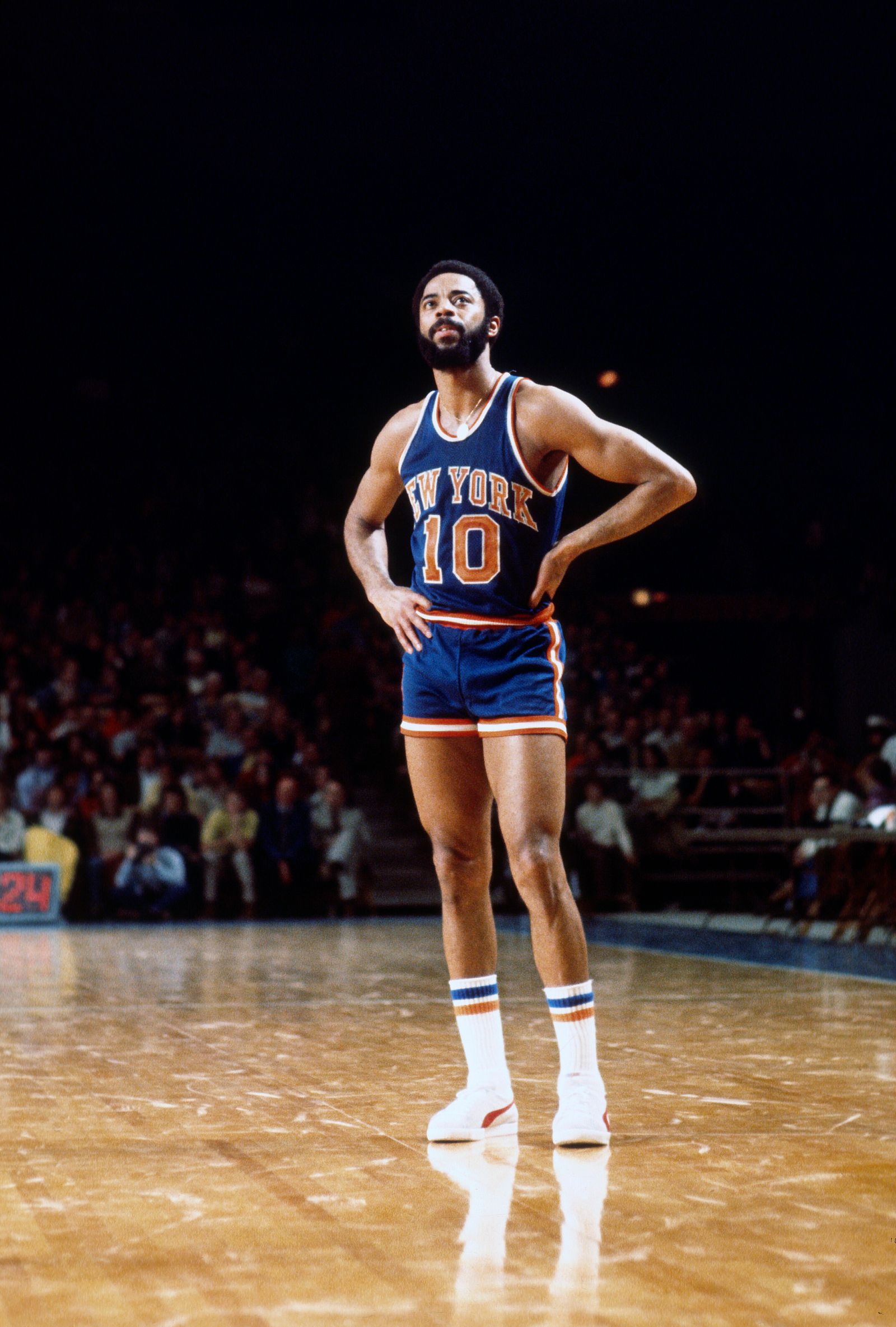 Image may contain Walt Frazier Adult Person Performer Solo Performance Clothing Shorts and Basketball
