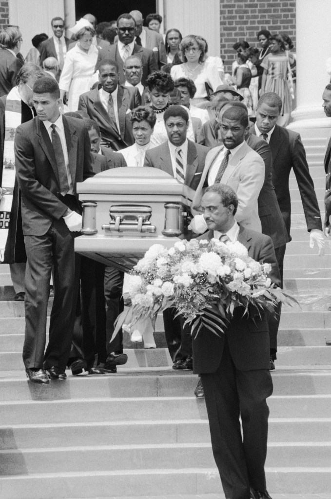 The casket containing the body of University of Maryland basketball star Len Bias is carried from the Univ. of Maryland Memorial Chapel