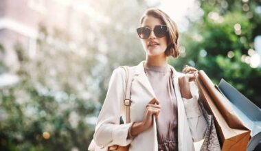 shopper carries paper bags with purchases