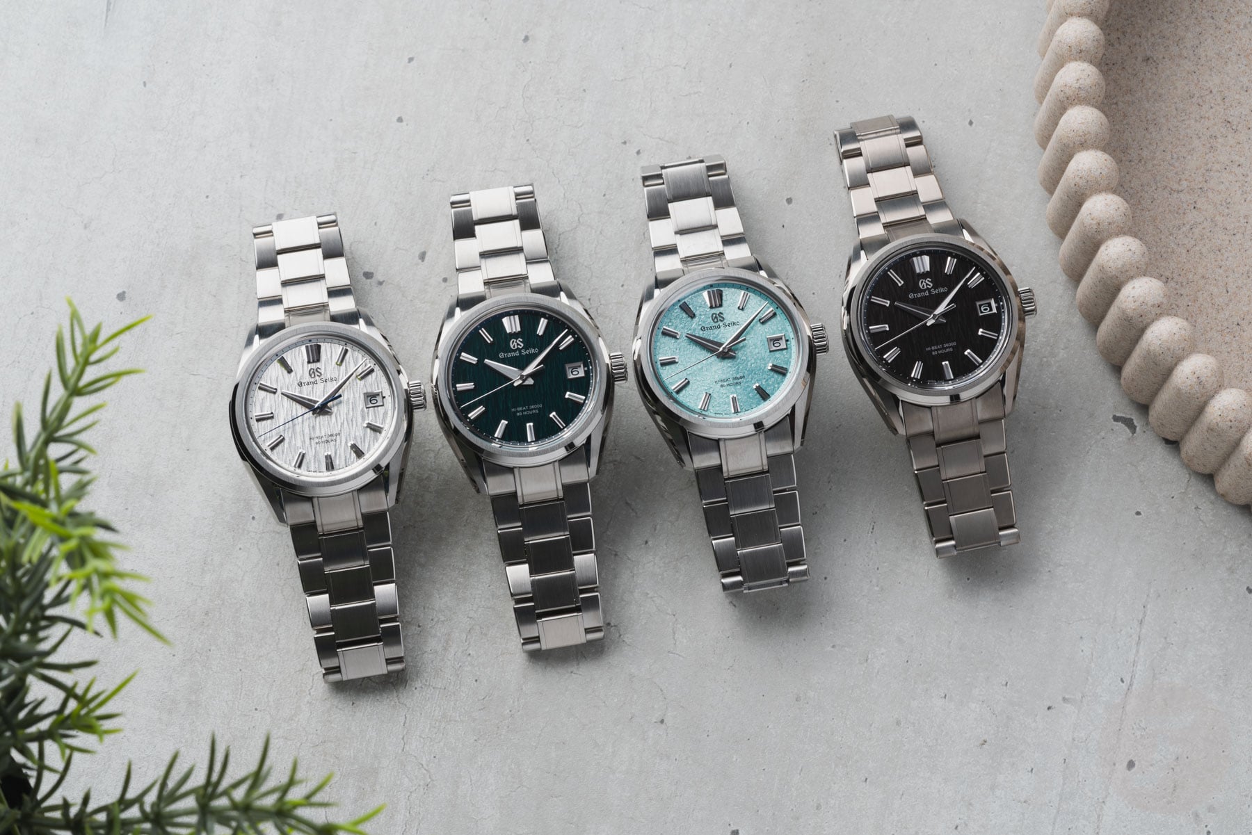 Grand Seiko Evolution 9 Hi-Beat 36000 SLGH031, SLGH033, SLGH035, and SLGH029 lined up, flat-lay