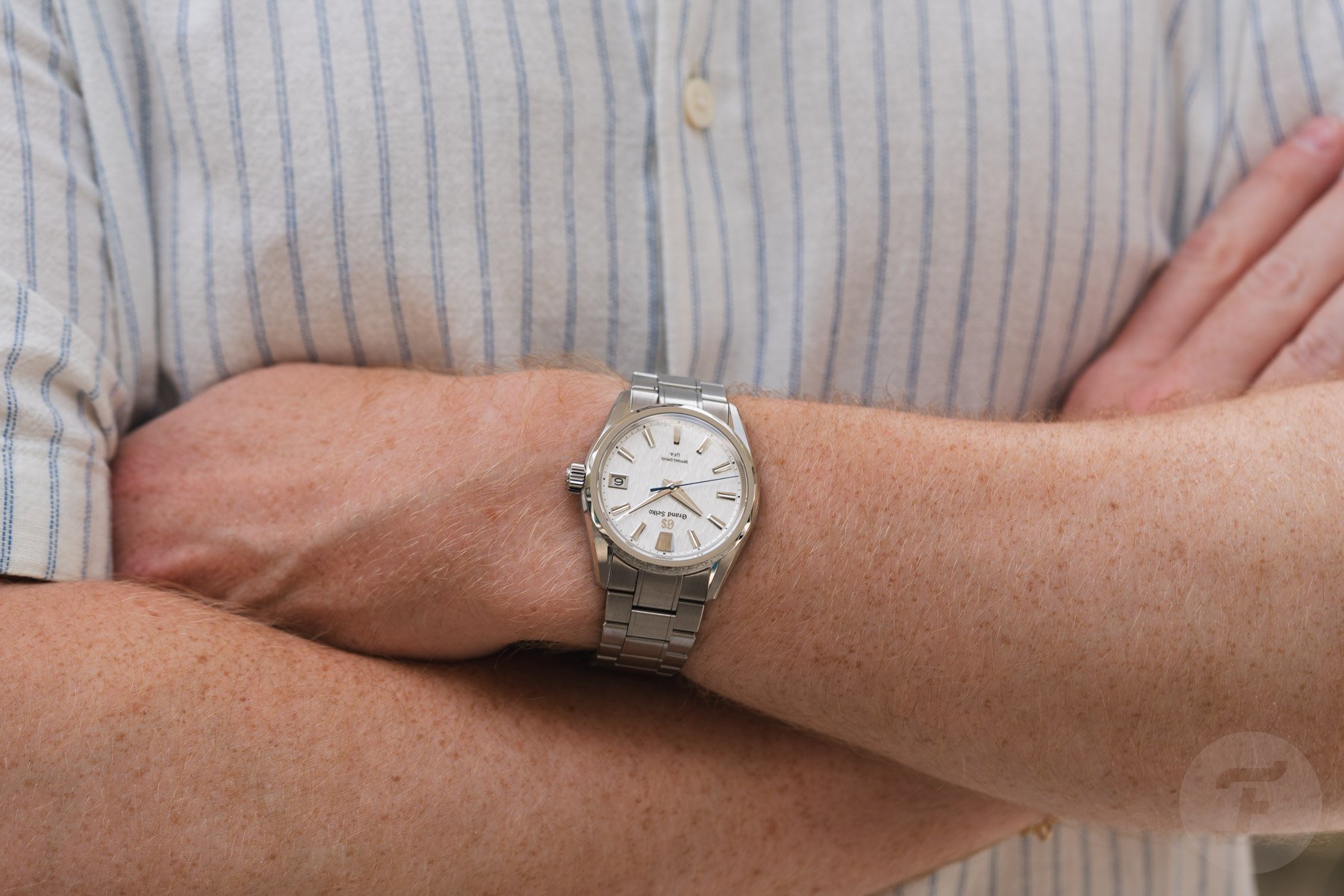 Grand Seiko Evolution 9 Spring Drive U.F.A. SLGB011on wrist, arms crossed